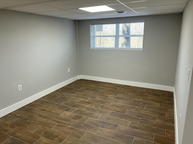 spare room featuring a paneled ceiling