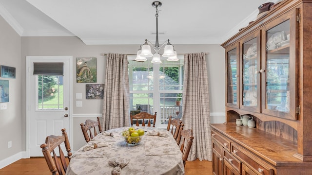 1605 Orchard Pl NE, Cleveland, TN 37323 - dining room featuring light wood-style floors, a chandelier, healthy amount of natural light, and ornamental molding