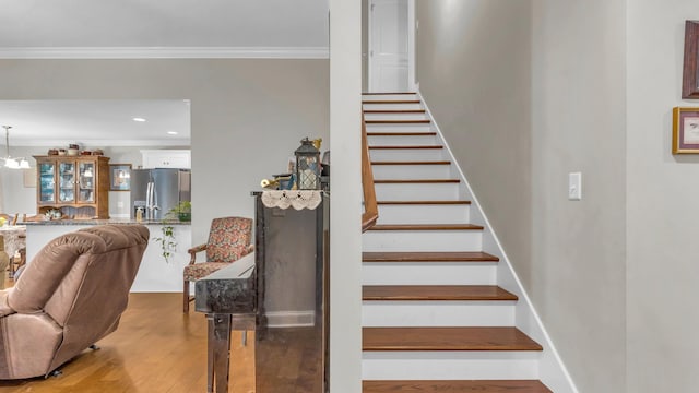 1605 Orchard Pl NE, Cleveland, TN 37323 - stairs with crown molding, wood finished floors, and recessed lighting