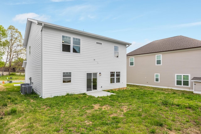 5029 Solar Ln NW, Cleveland, TN 37312 - rear view of house featuring central air condition unit and a lawn