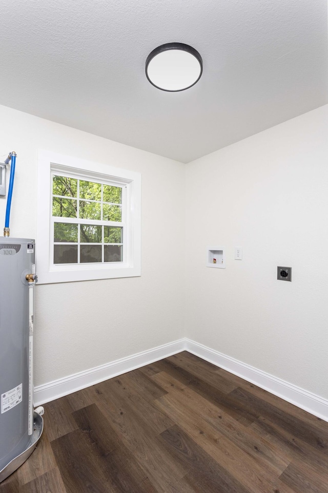 245 Graham St, Dayton, TN 37321 - clothes washing area featuring electric dryer hookup, water heater, laundry area, and dark wood-type flooring
