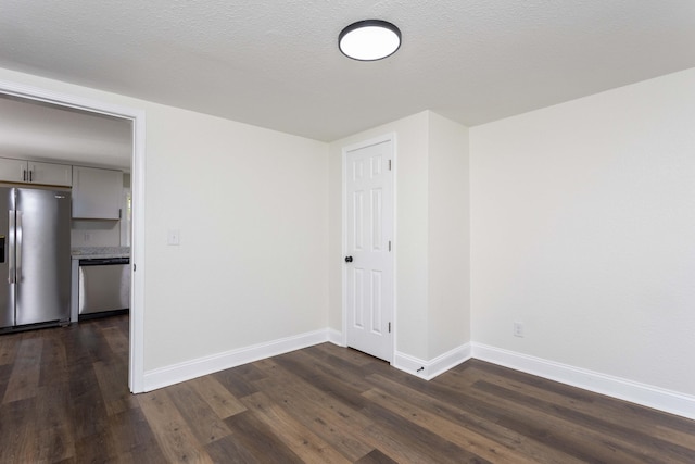 245 Graham St, Dayton, TN 37321 - spare room featuring baseboards and dark wood finished floors