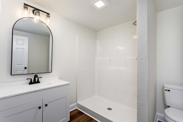 245 Graham St, Dayton, TN 37321 - bathroom with a shower, wood finished floors, toilet, and vanity
