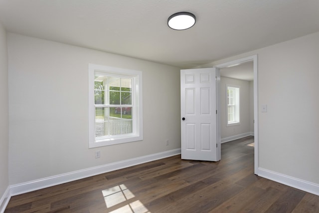 245 Graham St, Dayton, TN 37321 - empty room with dark wood-style flooring and baseboards