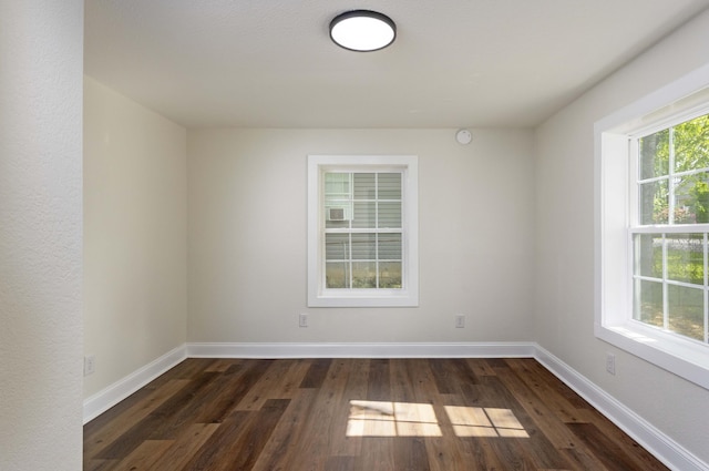245 Graham St, Dayton, TN 37321 - unfurnished room with dark wood finished floors and baseboards