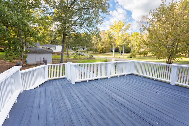 deck featuring a shed