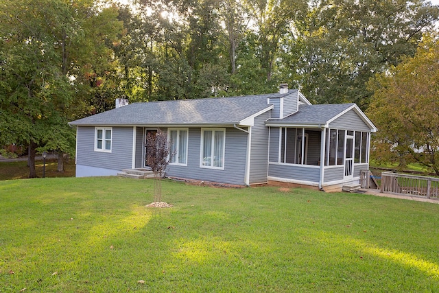 ranch-style home with a sunroom and a front yard