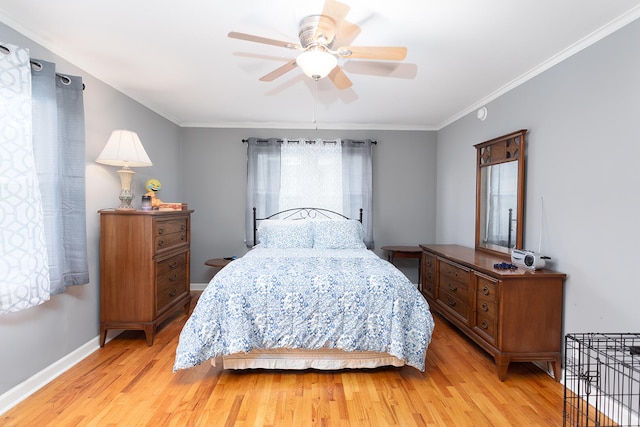 bedroom with ceiling fan, ornamental molding, and light wood-type flooring