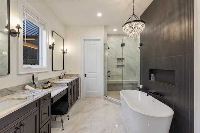 bathroom featuring vanity, a shower stall, marble finish floor, and a freestanding bath