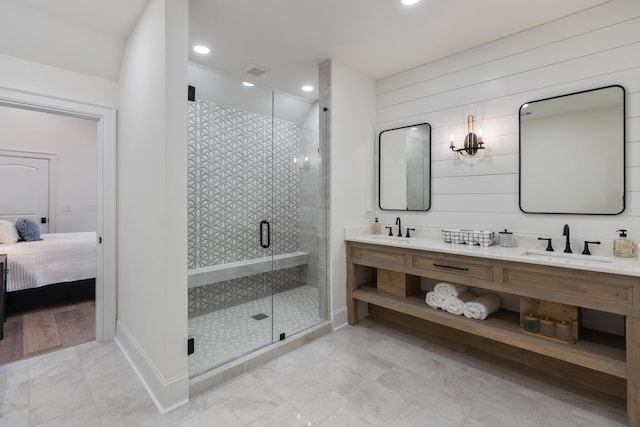 full bath with a shower stall, recessed lighting, visible vents, and a sink