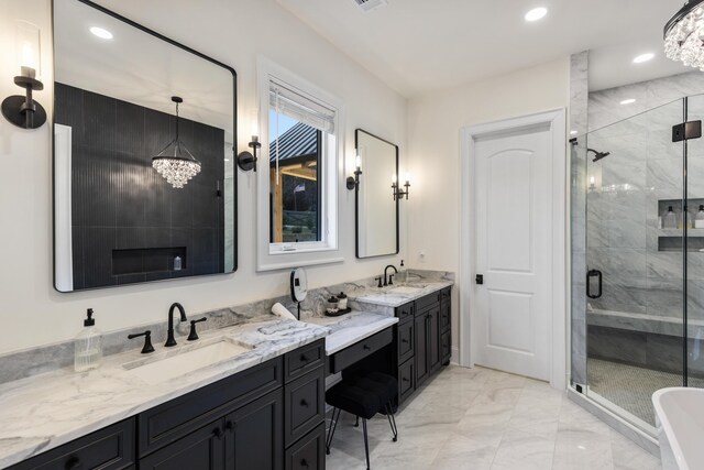 full bath with recessed lighting, a notable chandelier, marble finish floor, and a stall shower