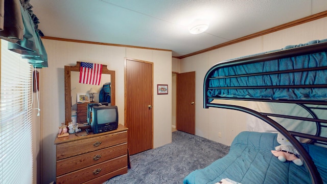 bedroom with carpet, a textured ceiling, and crown molding