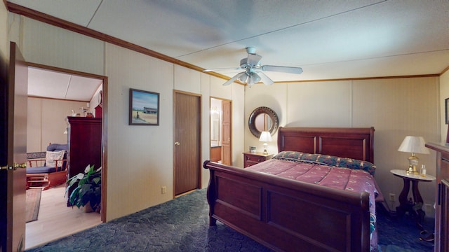 bedroom featuring ceiling fan, dark wood-type flooring, and ornamental molding