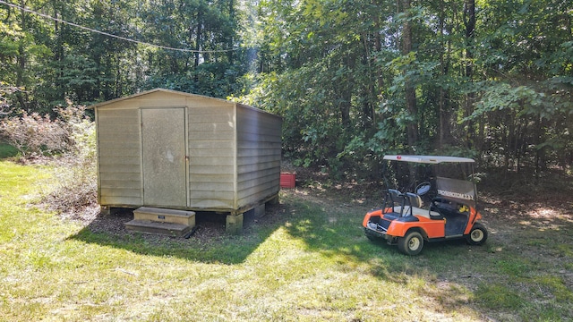 view of outbuilding with a lawn