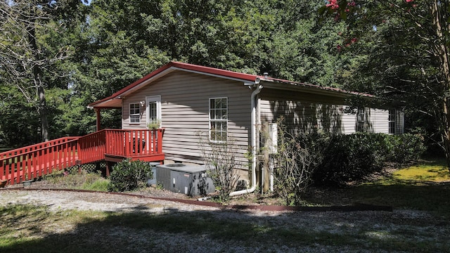 view of side of home featuring a deck