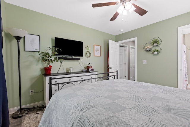 bedroom featuring ceiling fan and wood-type flooring