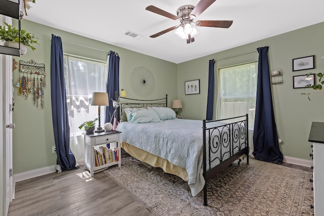 bedroom featuring hardwood / wood-style floors and ceiling fan