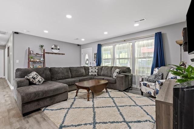 living room with light hardwood / wood-style floors