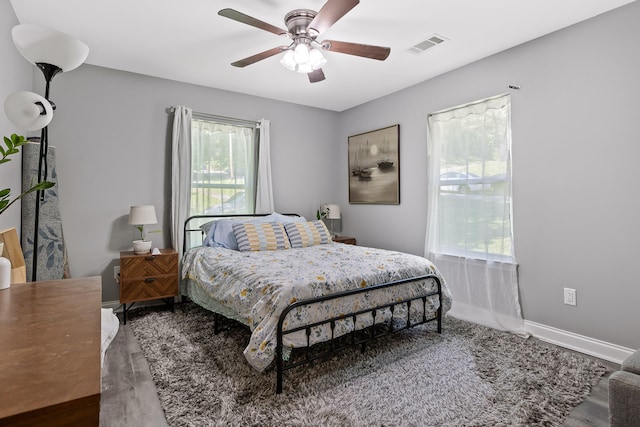 bedroom with hardwood / wood-style flooring and ceiling fan