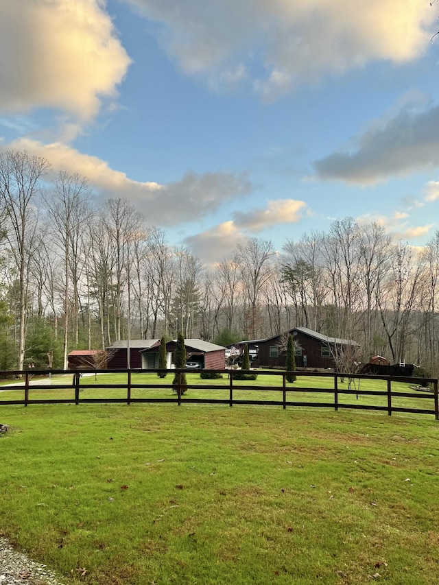 view of yard with a rural view