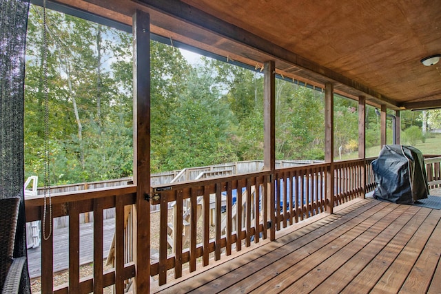 wooden terrace featuring grilling area