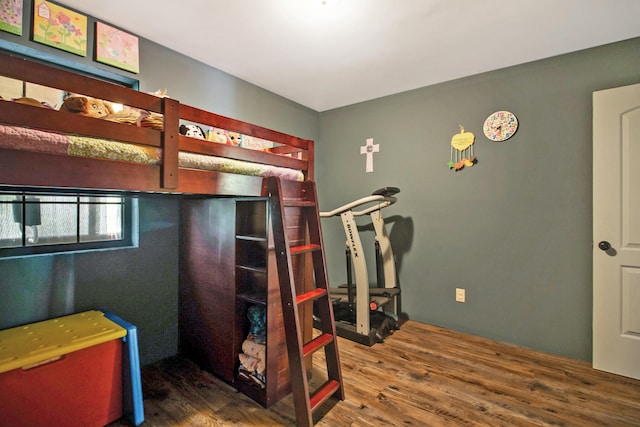 bedroom with hardwood / wood-style floors