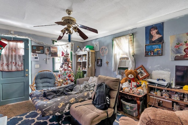 interior space featuring a textured ceiling, cooling unit, ceiling fan, crown molding, and carpet floors