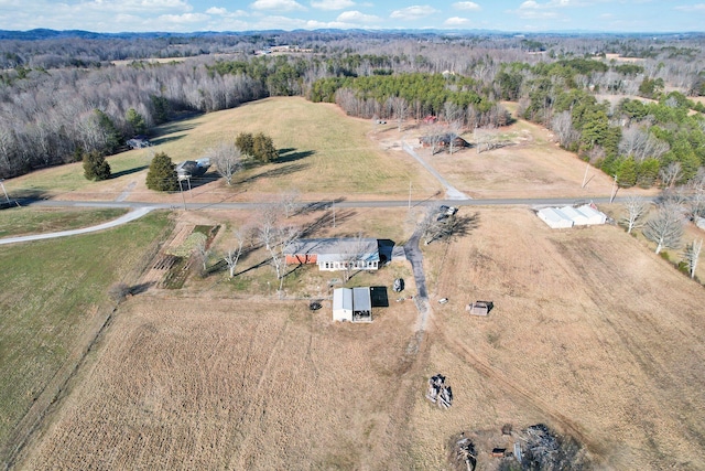 birds eye view of property with a rural view