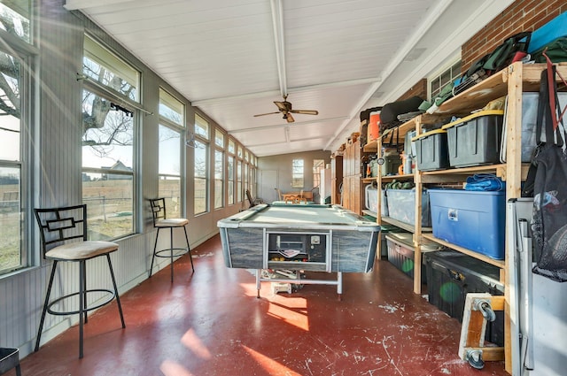 sunroom with vaulted ceiling, a wealth of natural light, ceiling fan, and billiards