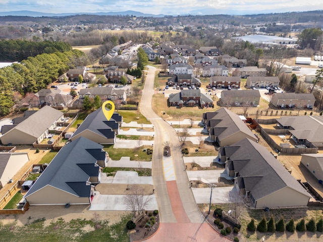 birds eye view of property with a residential view