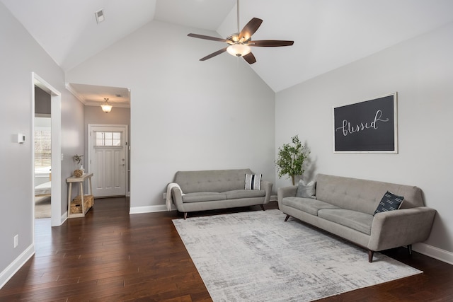 living room with dark wood-style floors, baseboards, and high vaulted ceiling