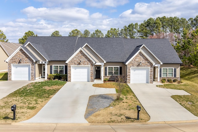 view of front of home featuring an attached garage, driveway, a shingled roof, and a front yard