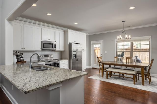 kitchen featuring dark wood-style floors, tasteful backsplash, appliances with stainless steel finishes, and crown molding