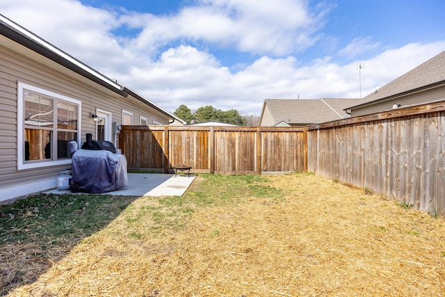 view of yard featuring fence private yard and a patio area