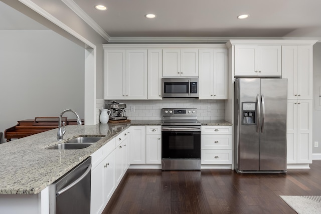 kitchen with light stone counters, dark wood-style floors, crown molding, stainless steel appliances, and a sink