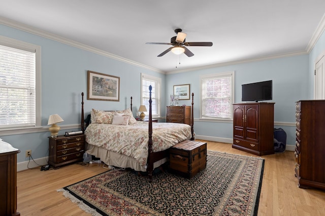 bedroom with baseboards, light wood-style flooring, and ornamental molding