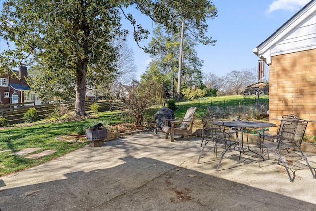 view of patio / terrace with outdoor dining area and fence