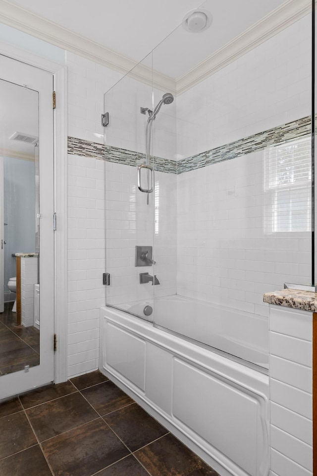 full bathroom featuring visible vents, enclosed tub / shower combo, toilet, and crown molding