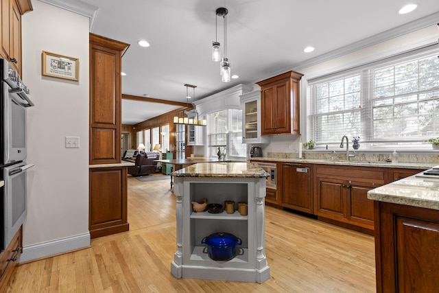 kitchen featuring light stone counters, open shelves, a sink, dishwasher, and double oven