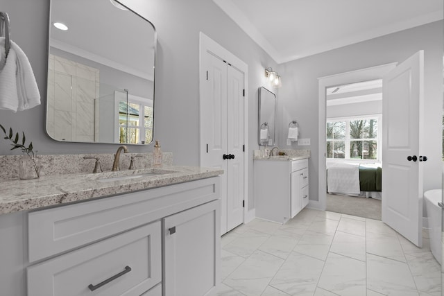 full bath featuring marble finish floor, two vanities, ensuite bathroom, ornamental molding, and a sink