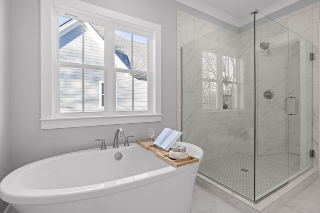 bathroom featuring marble finish floor, a soaking tub, and a marble finish shower