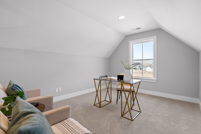 office space with lofted ceiling, baseboards, light carpet, and visible vents