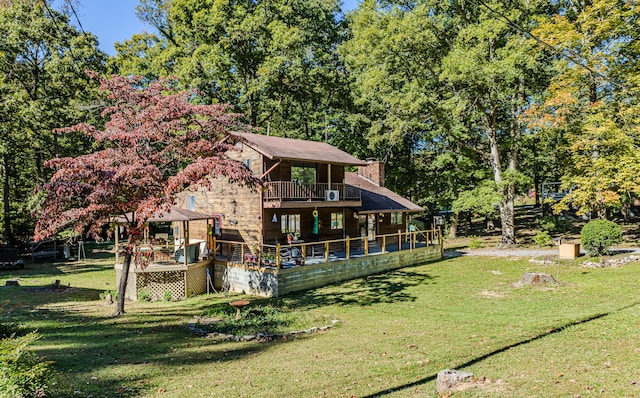 back of property featuring a lawn