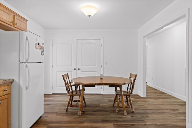 128 Mountain Breeze Ave, Dayton, TN 37321 - dining space with dark wood-style flooring and baseboards