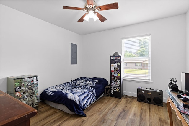 128 Mountain Breeze Ave, Dayton, TN 37321 - bedroom with electric panel, wood finished floors, ceiling fan, and baseboards