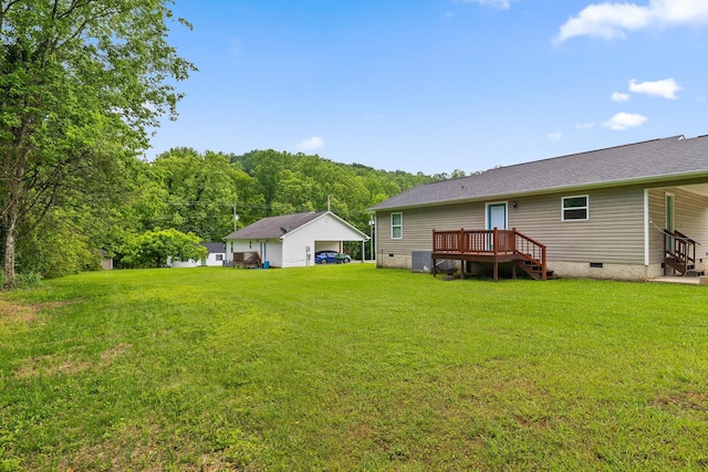 128 Mountain Breeze Ave, Dayton, TN 37321 - view of green lawn with a garage, a wooden deck, and central AC unit