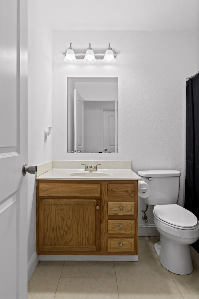 128 Mountain Breeze Ave, Dayton, TN 37321 - bathroom featuring vanity, toilet, tile patterned flooring, and baseboards