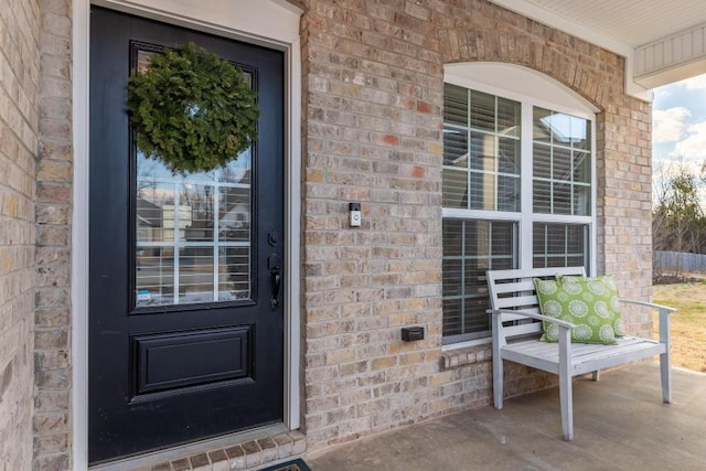 doorway to property featuring covered porch