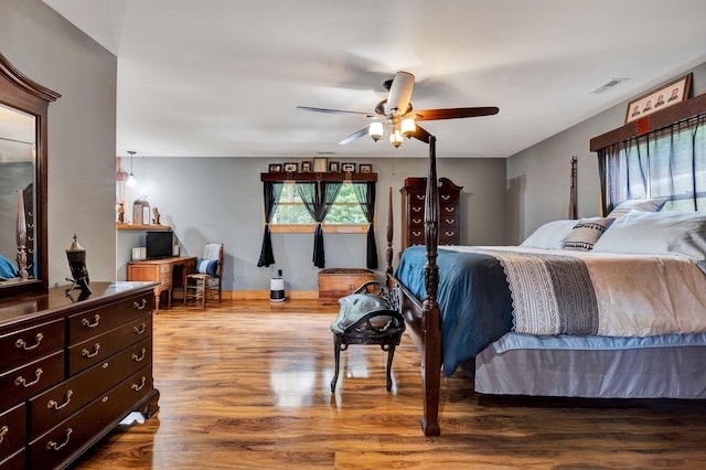 bedroom featuring hardwood / wood-style floors and ceiling fan