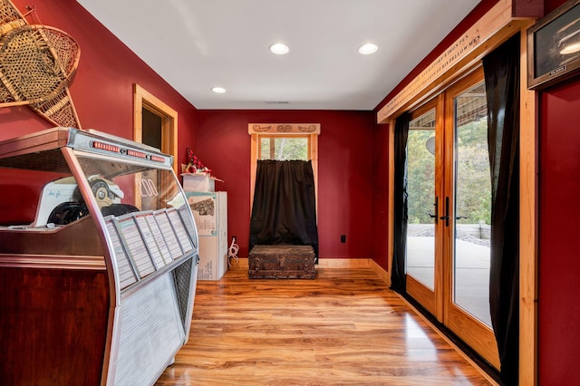 interior space with french doors and light wood-type flooring